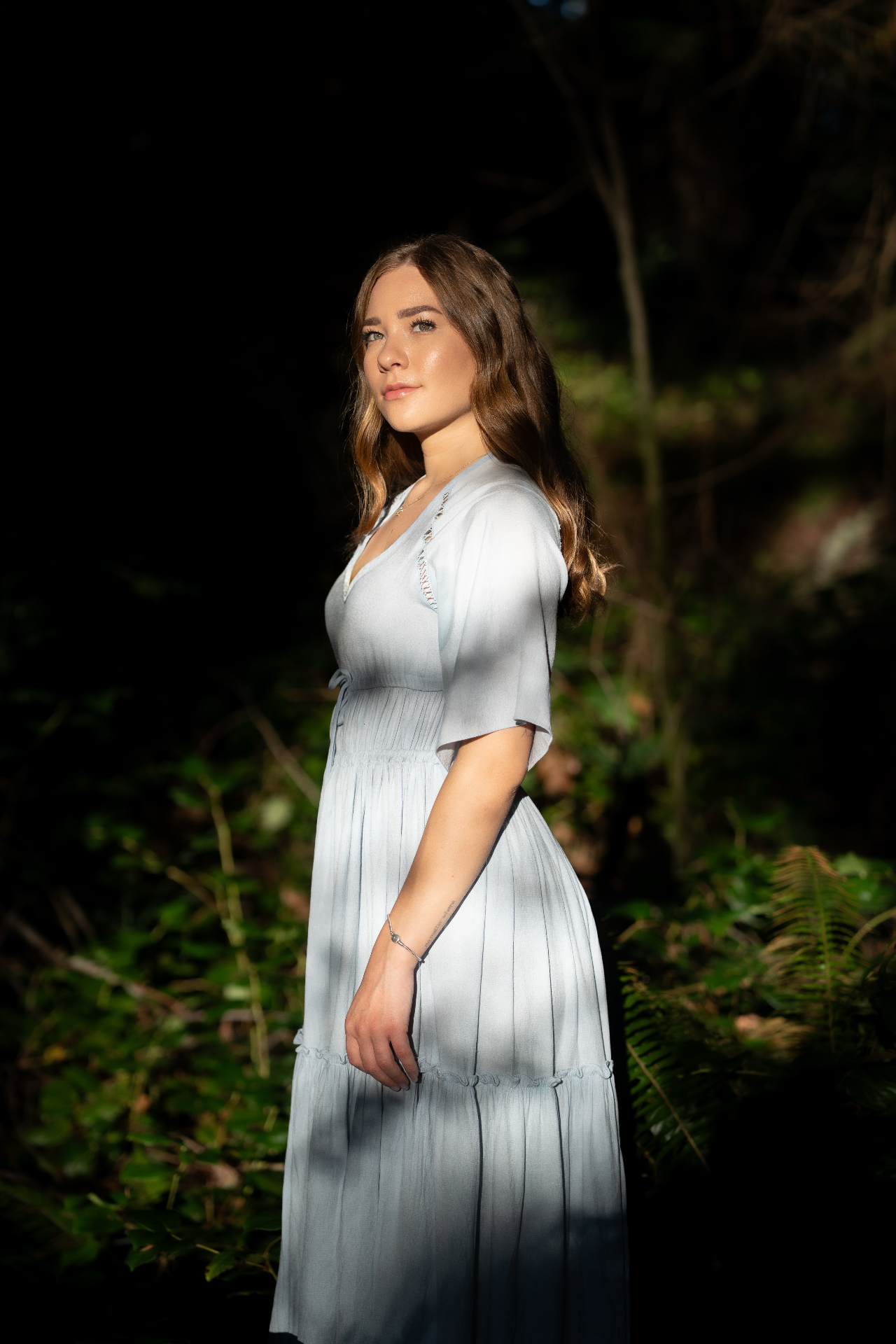 A portrait in soft light, surrounded by forest